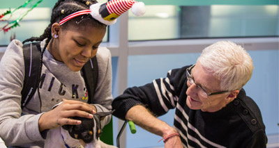 Young patients enjoy festive visit from Battersea dogs